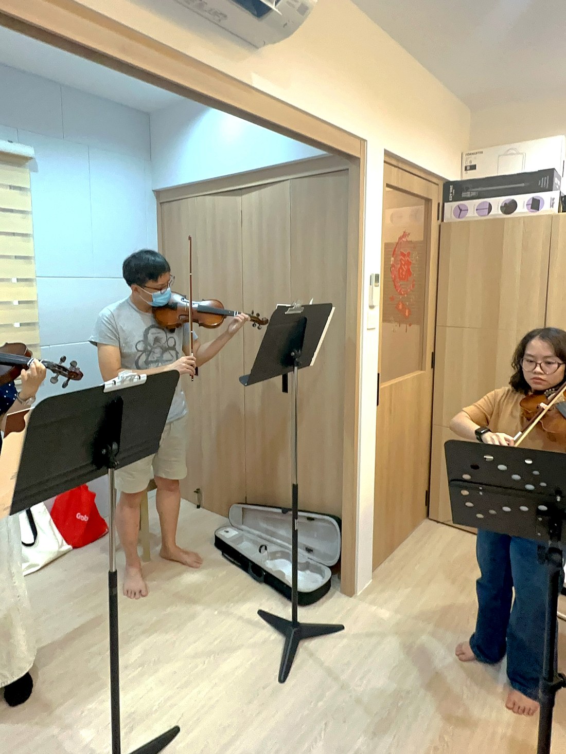 A student practising with a music stand